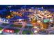 Aerial view of 'The Bowl' with people enjoying the shops, entertainment, and the inviting public square at 648 Bellingham Dr, Sugar Hill, GA 30518