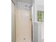Shower with shower head next to the tub and view of the backyard window at 648 Bellingham Dr, Sugar Hill, GA 30518