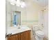 Bathroom featuring a sink, toilet, and a walk in shower and bath at 648 Bellingham Dr, Sugar Hill, GA 30518