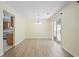 Open dining area with slider to outdoor patio, hardwood flooring and views of kitchen at 648 Bellingham Dr, Sugar Hill, GA 30518