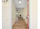 View of entryway leading to spacious living area, showcasing wood flooring and natural light at 648 Bellingham Dr, Sugar Hill, GA 30518