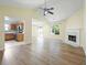 Bright open-concept living space with fireplace and access to updated kitchen and outdoor patio at 648 Bellingham Dr, Sugar Hill, GA 30518