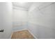 Walk-in closet featuring carpet and shelves on three sides at 648 Bellingham Dr, Sugar Hill, GA 30518
