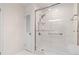Bathroom featuring walk-in shower with glass door and neutral tile at 870 Richmond Hill Dr, Marietta, GA 30068