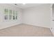 Bright bedroom with neutral carpet and window with plantation shutters at 870 Richmond Hill Dr, Marietta, GA 30068