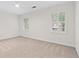 Large bedroom with neutral carpet, white walls, and shuttered windows at 870 Richmond Hill Dr, Marietta, GA 30068
