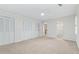 Bedroom with neutral carpet, white walls, ceiling fan, large windows and multiple closets at 870 Richmond Hill Dr, Marietta, GA 30068