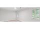 Spacious bedroom with neutral carpet, white walls, and shuttered windows at 870 Richmond Hill Dr, Marietta, GA 30068