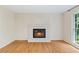 Bright room featuring hardwood floors and fireplace at 870 Richmond Hill Dr, Marietta, GA 30068