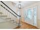 Bright foyer with hardwood floors, staircase, and a stylish chandelier, welcoming guests at 870 Richmond Hill Dr, Marietta, GA 30068