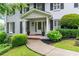 Inviting front porch with decorative planters and meticulously maintained landscaping at 870 Richmond Hill Dr, Marietta, GA 30068