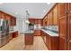 Bright kitchen with wood cabinets, stainless steel appliances, and kitchen island at 870 Richmond Hill Dr, Marietta, GA 30068
