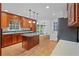Traditional-style kitchen features wooden cabinets, island, and modern stainless steel appliances at 870 Richmond Hill Dr, Marietta, GA 30068