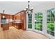 Kitchen with wood cabinets, modern appliances, and natural light from window at 870 Richmond Hill Dr, Marietta, GA 30068