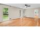 Spacious living room with hardwood floors, ceiling fan, and ample natural light at 870 Richmond Hill Dr, Marietta, GA 30068