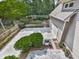 Aerial view of a backyard featuring garage, patio, landscaping, and green bushes at 1110 Parkview Se Pl, Smyrna, GA 30080