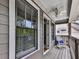 Balcony featuring rocking chair, white ceiling fan, and gray siding at 1110 Parkview Se Pl, Smyrna, GA 30080