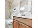 Bathroom featuring a vanity with wood cabinets, shower-tub combo, and tile flooring at 1110 Parkview Se Pl, Smyrna, GA 30080