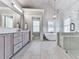 Bathroom featuring double vanity, stand alone tub, and glass enclosed shower at 1110 Parkview Se Pl, Smyrna, GA 30080