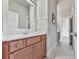 Bathroom featuring a white quartz vanity, sink, and view to hallway at 1110 Parkview Se Pl, Smyrna, GA 30080