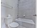 Bathroom featuring a toilet, bath tub, shower, and towel rack at 1110 Parkview Se Pl, Smyrna, GA 30080