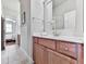 Bright bathroom featuring a vanity, sink, and view to bedroom at 1110 Parkview Se Pl, Smyrna, GA 30080