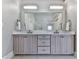 Bathroom featuring double vanity, large mirror, and tile flooring at 1110 Parkview Se Pl, Smyrna, GA 30080
