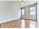 Bright bedroom with hardwood floors, neutral walls, and two windows at 1110 Parkview Se Pl, Smyrna, GA 30080