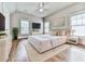 Elegantly furnished bedroom with a plush bed, modern decor, and a large window for natural light at 1110 Parkview Se Pl, Smyrna, GA 30080