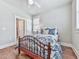 Comfortable bedroom with hardwood floors and a bed with plush blue pillows at 1110 Parkview Se Pl, Smyrna, GA 30080