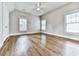 Spacious bedroom with hardwood floors, neutral walls, and ample natural light from multiple windows at 1110 Parkview Se Pl, Smyrna, GA 30080