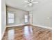 Bright bedroom with hardwood floors, neutral walls, and a ceiling fan at 1110 Parkview Se Pl, Smyrna, GA 30080