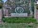 Entrance sign for Parkview Village community surrounded by lush greenery and decorative wrought iron fencing at 1110 Parkview Se Pl, Smyrna, GA 30080