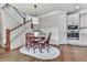Charming dining area adjacent to the kitchen with a modern light fixture and stairs to the left at 1110 Parkview Se Pl, Smyrna, GA 30080