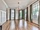 Elegant dining room with hardwood floors, modern lighting, and large windows at 1110 Parkview Se Pl, Smyrna, GA 30080
