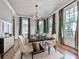 Elegant dining room with modern light fixture and table set for a formal dinner at 1110 Parkview Se Pl, Smyrna, GA 30080