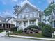 Attractive two-story home with covered porch, white columns and railings, and lush front yard landscaping at 1110 Parkview Se Pl, Smyrna, GA 30080
