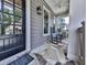 Charming porch featuring rocking chairs and stone flooring, perfect for enjoying the outdoors at 1110 Parkview Se Pl, Smyrna, GA 30080