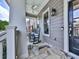 Cozy front porch featuring classic rocking chairs, stone flooring, and a ceiling fan, creating a welcoming space at 1110 Parkview Se Pl, Smyrna, GA 30080