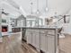 Open-concept kitchen with a central island, modern cabinetry, and seamless connection to the living area at 1110 Parkview Se Pl, Smyrna, GA 30080