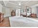 Spacious main bedroom with a canopy bed, neutral carpet, and tray ceiling at 1110 Parkview Se Pl, Smyrna, GA 30080