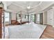 Large main bedroom with hardwood floors, canopy bed, and access to outdoor balcony at 1110 Parkview Se Pl, Smyrna, GA 30080