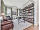 Bright office space featuring hardwood floors, custom shelving, and an abundance of natural light at 1110 Parkview Se Pl, Smyrna, GA 30080