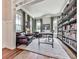 Bright office space featuring hardwood floors, custom shelving, and an abundance of natural light at 1110 Parkview Se Pl, Smyrna, GA 30080