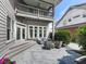 This home features a lovely patio with wicker furniture, accessed via a door and stairs at 1110 Parkview Se Pl, Smyrna, GA 30080