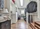 Walk-in closet with custom shelving, hanging racks, and hardwood flooring at 1110 Parkview Se Pl, Smyrna, GA 30080