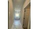 Elegant bathroom featuring a sleek, freestanding tub, and stylish marble-look tile flooring, creating a spa-like atmosphere at 149 Silvercrest Dr, Acworth, GA 30101