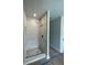 New bathroom with a shower featuring marble-style tile surround and matte black fixtures at 149 Silvercrest Dr, Acworth, GA 30101