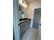 Bathroom featuring double sink vanity with gray cabinets and tiled floor at 149 Silvercrest Dr, Acworth, GA 30101