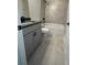 Modern bathroom with gray vanity, double sinks, tile flooring, and combined tub and shower at 149 Silvercrest Dr, Acworth, GA 30101